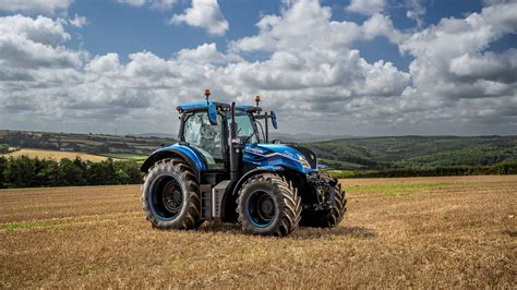 Thematic photo of a New Holland tractor working in a field in Mazowieckie