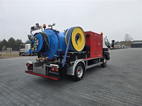 Thematic photo of a WUKO truck in action cleaning sewage systems