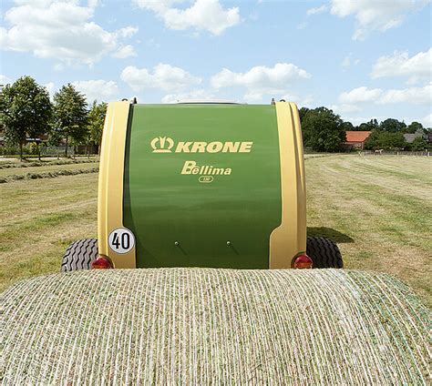 Close-up of the PowerBind net wrapping system engaging a bale