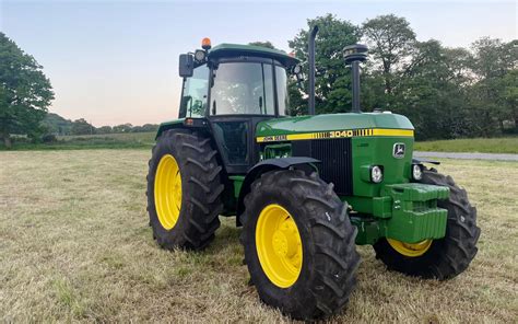 Thematic photo of John Deere 3040 tractor working in a field