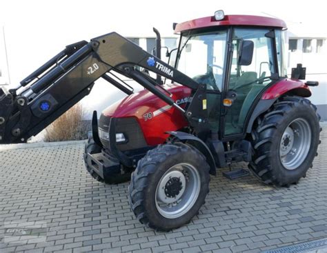 Infografika prezentująca kluczowe wymiary ciągnika rolniczego Case IH JX 70