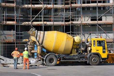 Thematic photo of a concrete mixer truck in operation on a construction site