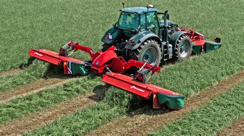 Kverneland mower cutter bar with detailed view of skids/shoes