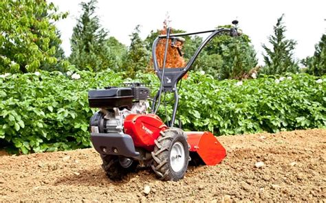Thematic photo of Pubert ROTO 408 rotary tiller working in a garden