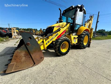Widok na podwozie i zwolnice koparko-ładowarki New Holland B90B ze wskazaniem miejsca montażu hamulców