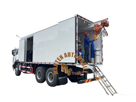 Thematic photo of a truck with a right-hand drive (RHD) being modified in a workshop