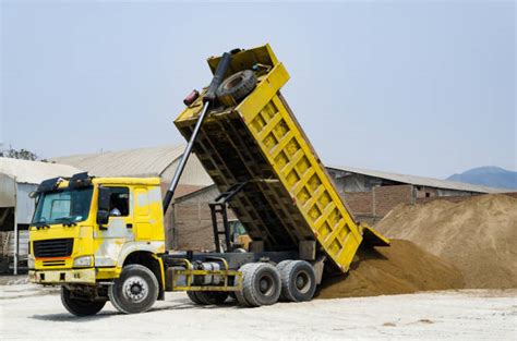 Photo of a tipper truck delivering sand or gravel