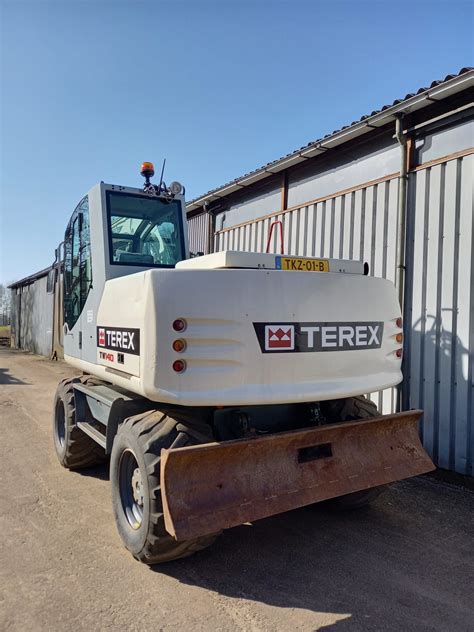 Schematyczny widok koparki kołowej Terex TW140