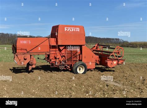 Historical photo of an early Fahr combine harvester or factory