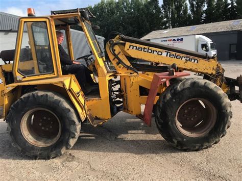 The Matbro Teleram telehandler working on a farm, lifting bales
