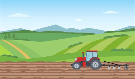 Zabawny traktor Florek na tle wiejskiego krajobrazu