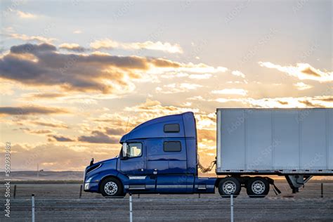 Thematic photo of a truck tractor with a semi-trailer on the road