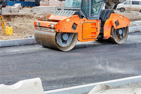 Thematic photo of a vibratory roller working on an asphalt road