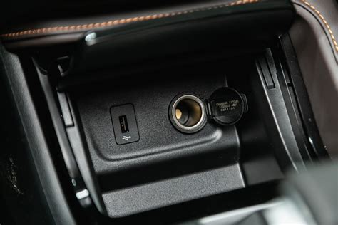 Thematic photo of a tractor interior with an installed cigarette lighter socket.