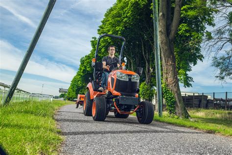 Thematic photo of Kubota BX231 compact tractor with a front loader