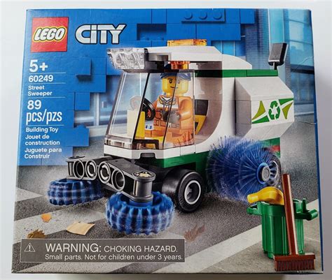 Schemat budowy zamiatarki LEGO City (60249) z instrukcją krok po kroku.
