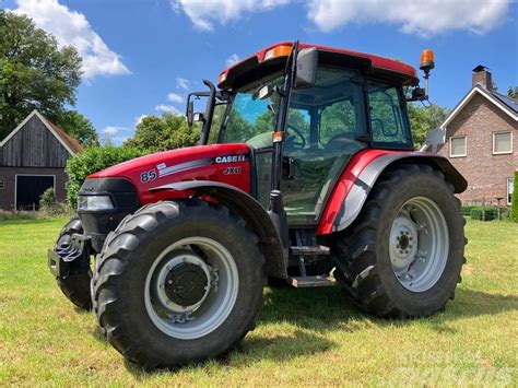Thematic photo of Case IH JXU 105 tractor working on a farm