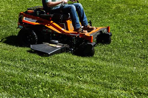 Thematic photo of a modern garden tractor or zero-turn mower in action on a large lawn