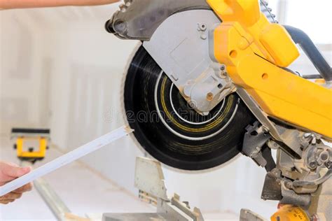 Thematic photo of a miter saw in a workshop, focusing on precision cutting