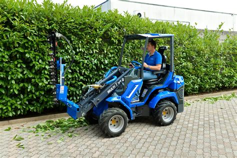 The MultiOne SD Series mini loader working in a tight agricultural space