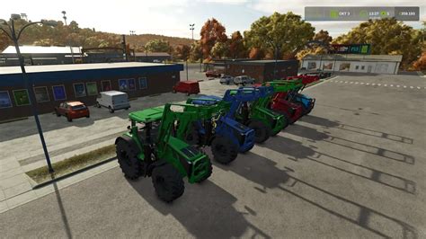 Traktor z zamontowanym ładowaczem czołowym w Farming Simulator 15