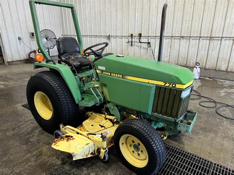 The John Deere 770 tractor in a rural setting, showing its compact size