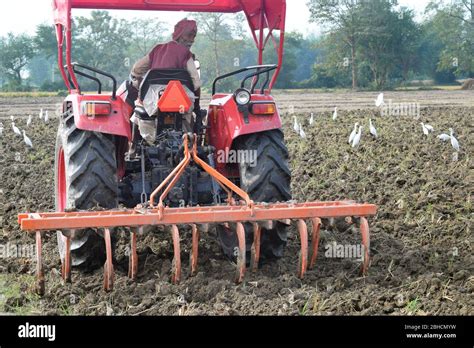Photo of a tractor with a plough