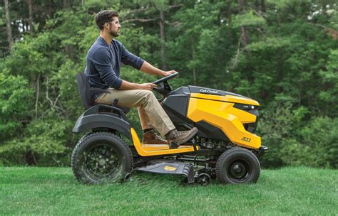 Thematic photo of a modern Cub Cadet lawn tractor in a garden setting