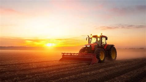 Thematic photo of a used tractor in a field at sunset, symbolizing hard work and investment