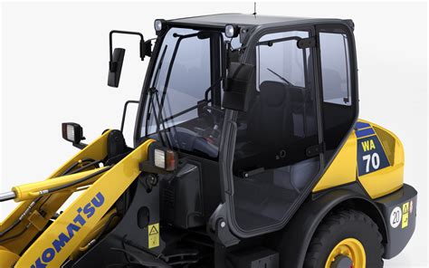 Zdjęcie przedstawiające ładowarkę kołową Komatsu WA70-7 w trakcie pracy na placu budowy