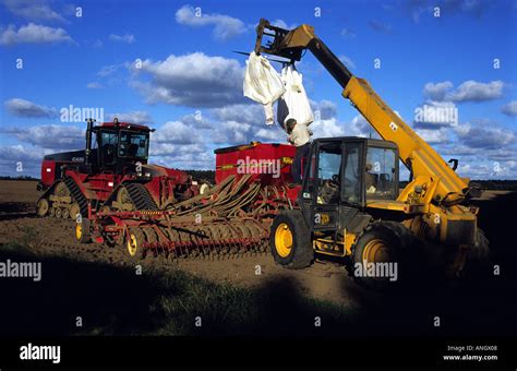 Photo of a seed drill loaded on a low-loader trailer
