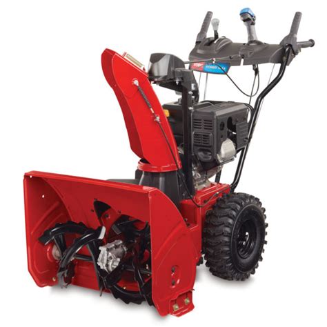 The Toro Power Max 826 OAE snow blower clearing snow from a driveway