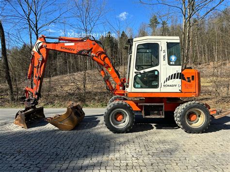 Thematic photo of a Schaeff HML 42 wheeled excavator working on a construction site