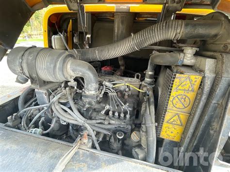 Lokalizacja filtra kabinowego w ładowarce Komatsu WA 75 (schemat lub zdjęcie)