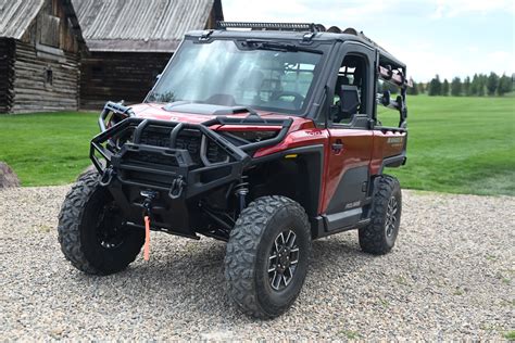Detailed diagram or photo showing various accessories mounted on a Polaris Ranger for agricultural tasks.