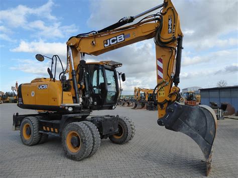 The JCB JS175W wheeled excavator working on a construction site, highlighting its mobility and robust design.