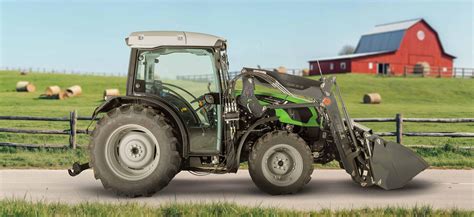 Thematic photo of a Stoll front loader working on a farm, ideally with a modern tractor.