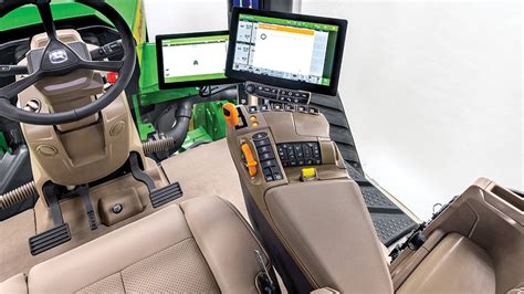 Interior of a modern John Deere sprayer cab with Command Arm and display