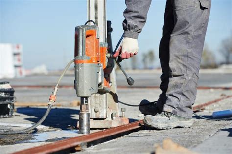 Photo of a concrete core drill in use