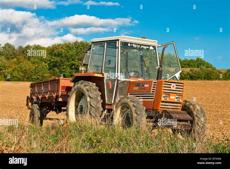 Thematic photo of a vintage Fiat 780 DT tractor working in a field