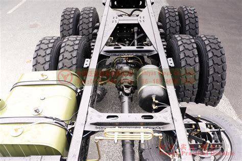 Infographic showing key inspection points on a dump truck chassis