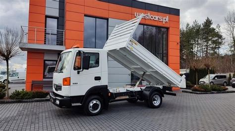 Photo of a Nissan Atleon dump truck (wywrotka) in action or parked at a construction site