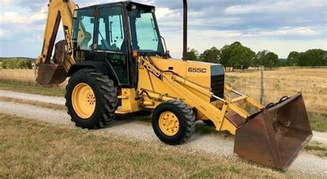 Thematic photo of a Ford 655 or 655C backhoe loader working on a construction site