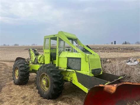Zdjęcie ciągnika zrywkowego Tree Farmer C5 w lesie