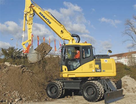 Thematic photo of a Komatsu PW140 wheeled excavator working