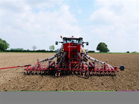 Thematic photo of Kverneland Optima seeder working in a field