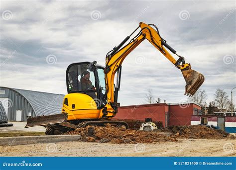 Thematic photo of a mini excavator working on a construction site
