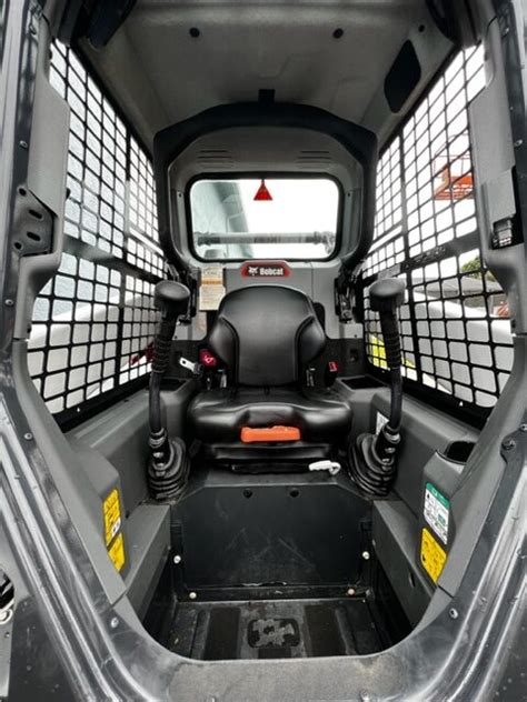 Interior view of Bobcat TL 470 cabin with ergonomic controls