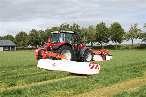 Thematic photo of Kuhn GMD 4411 disc mower working in a field