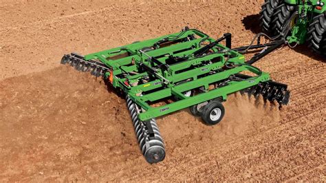 Thematic photo of a rotary harrow working in a field
